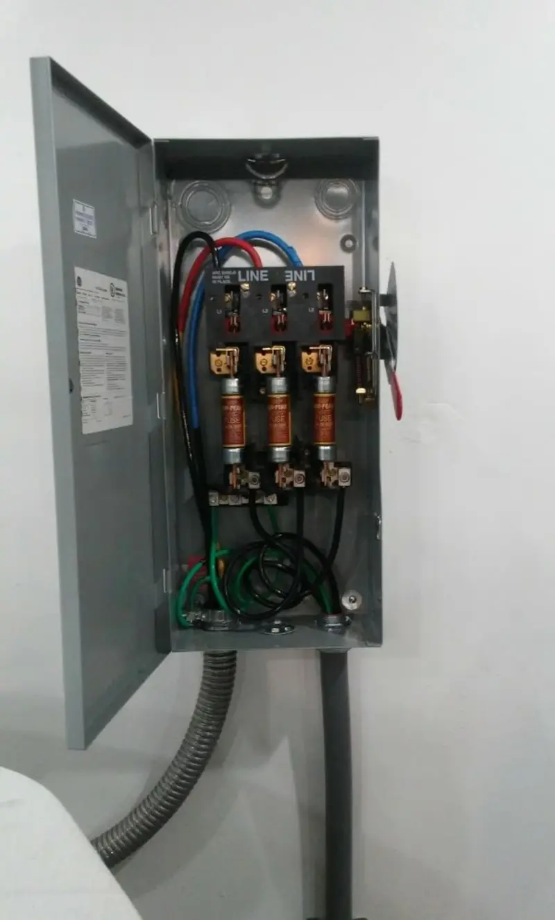 Three-phase disconnect switch installed for Smoke Detector Installation in Winter Beach